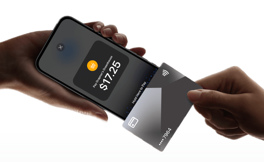 A customer holding a card to an iPhone running AlfaPOS to pay $17.25